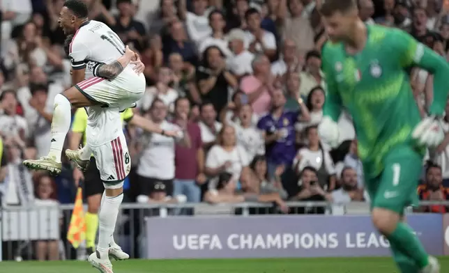 Real Madrid's Federico Valverde celebrates with Kylian Mbappe scoring his side's second goal during a Champions League soccer match between Real Madrid and Inter Milan in Madrid, Spain, Tuesday, Sept. 8, 2026. (AP Photo/Bernat Armangue)
