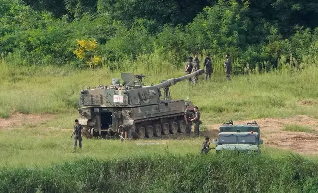 South Korean army soldiers work near their K-9 self-propelled howitzer in Paju, South Korea, near the border with North Korea, Sunday, Sept. 6, 2026. (AP Photo/Ahn Young-joon)