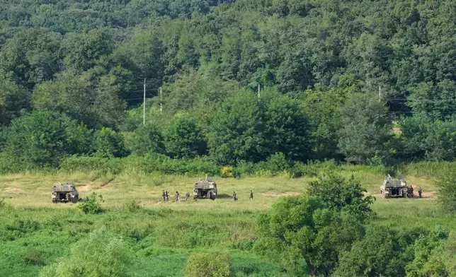 South Korean army K-9 self-propelled howitzers take positions in Paju, South Korea, near the border with North Korea, Sunday, Sept. 6, 2026. (AP Photo/Ahn Young-joon)