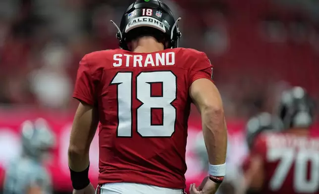 Atlanta Falcons quarterback Jack Strand (18) walks the field during an NFL football game against the Carolina Panthers in Atlanta, Sunday, Sept. 20, 2026. (AP Photo/Mike Stewart)
