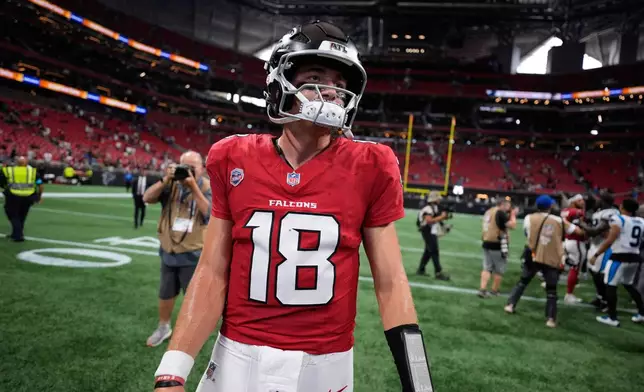 Atlanta Falcons quarterback Jack Strand (18) walks off the filed after an NFL football game against the Carolina Panthers in Atlanta, Sunday, Sept. 20, 2026. (AP Photo/Mike Stewart)
