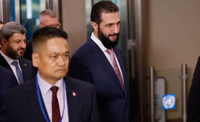 Syria's President Ahmed al-Sharaa, right, arrives ahead of the 81st session of the United Nations General Assembly at United Nations headquarters, Tuesday, Sept. 22, 2026. (AP Photo/Stefan Jeremiah)