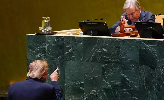 President Donald Trump points toward United Nations Secretary-General Antonio Guterres, after speaking to the United Nations General Assembly, Tuesday, Sept. 22, 2026, at the UN headquarters. (AP Photo/Julia Demaree Nikhinson)