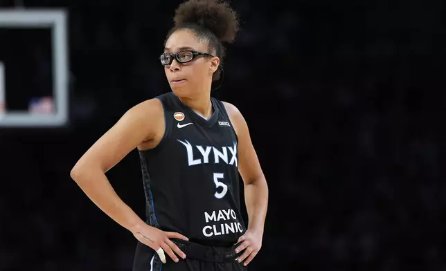 Minnesota Lynx guard Olivia Miles stands on the court during the second half of a WNBA basketball game against the New York Liberty, Friday, Sept. 18, 2026, in Minneapolis. (AP Photo/Abbie Parr)