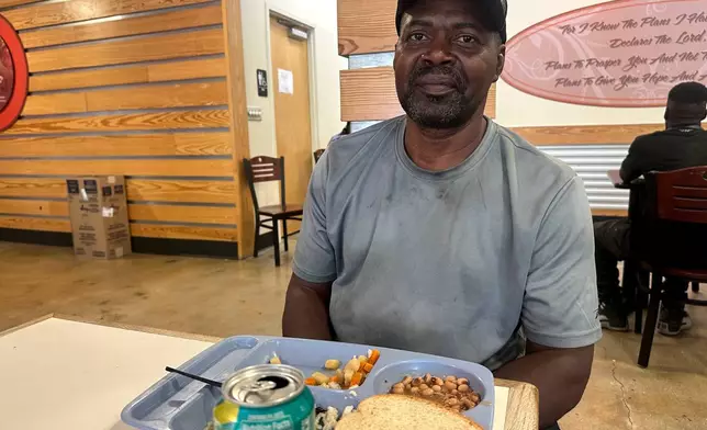 Calvin Ray Marshall, 59, discusses SNAP benefits after a free hot lunch at Christian Service, Tuesday, Aug. 25, 2026, in Shreveport, La. (AP Photo/Lisa Mascaro)