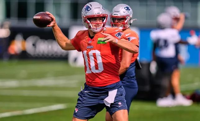 New England Patriots quarterback Drake Maye throws a pass during an NFL football practice, Wednesday, Sept. 16, 2026, in Foxborough, Mass. (AP Photo/Charles Krupa)