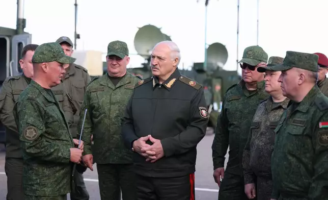 In this photo, released by Belarusian Presidential Press Service, Belarusian President Alexander Lukashenko, center, visits the Obuz-Lesnovsky combined-arms training ground, Belarus, on Friday, Sept. 11, 2026. (Belarusian Presidential Press Service via AP)