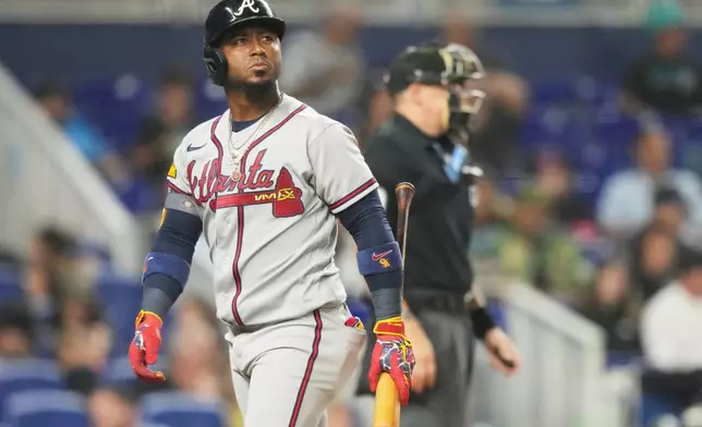 Atlanta Braves' Ozzie Albies walks to the dugout after striking out during the fifth inning of a baseball game against the Miami Marlins, Friday, Sept. 25, 2026, in Miami. (AP Photo/Lynne Sladky)
