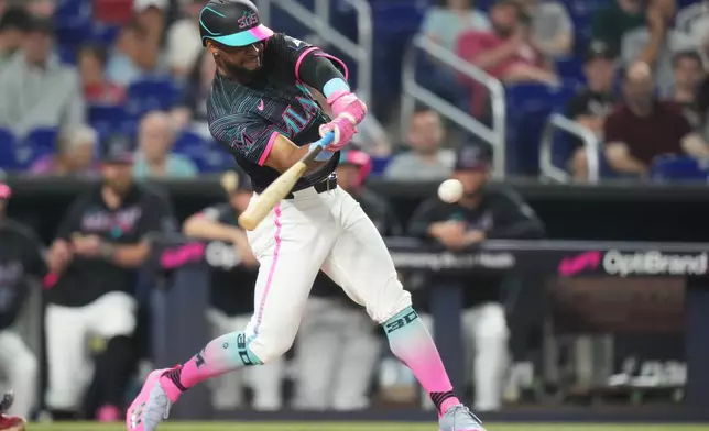 Miami Marlins' Otto Lopez hits a single during the first inning of a baseball game against the Atlanta Braves, Friday, Sept. 25, 2026, in Miami. (AP Photo/Lynne Sladky)