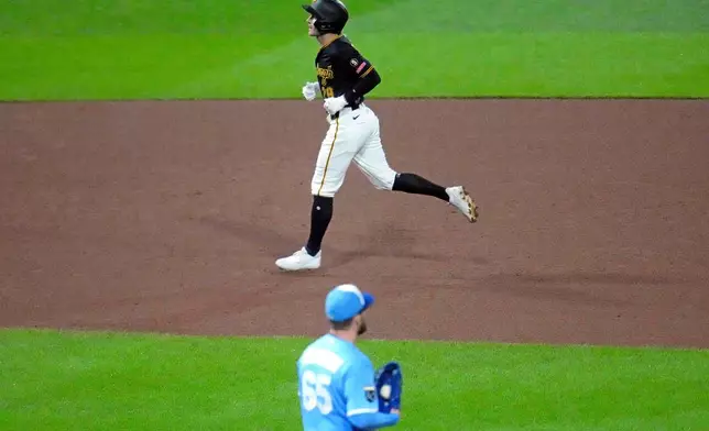 Pittsburgh Pirates' Jake Mangum, top, rounds the bases after hitting a two-run home run off Kansas City Royals pitcher Noah Cameron (65) during the fourth inning of a baseball game in Pittsburgh, Saturday, Sept. 19, 2026. (AP Photo/Gene J. Puskar)
