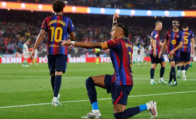 Barcelona's Raphinha celebrates after scoring his side's fifth goal from the penalty spot during a Spanish La Liga soccer match between Barcelona and Racing de Santander in Barcelona, Spain, Wednesday, Sept. 16, 2026. (AP Photo/Joan Monfort)