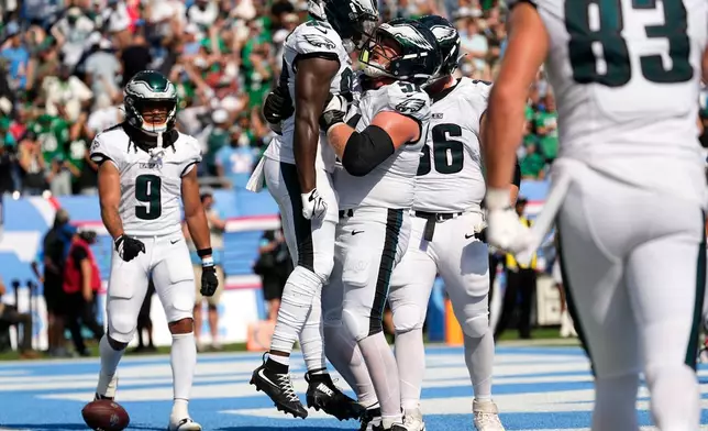 Philadelphia Eagles wide receiver Darius Cooper (80) celebrates with teammates after catching a touchdown pass during the second half of an NFL football game against the Tennessee Titans, Sunday, Sept. 20, 2026, in Nashville, Tenn.(AP Photo/George Walker IV)