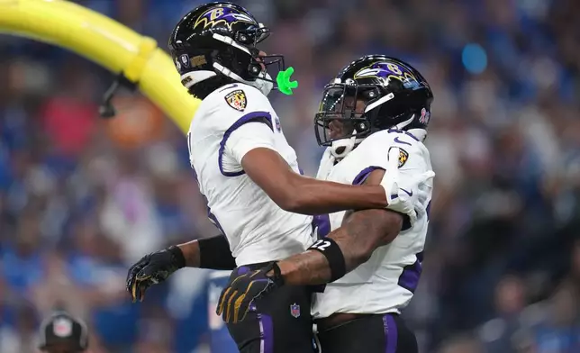 Baltimore Ravens' Derrick Henry celebrates his touchdown run with Ja'kobi Lane during the first half of an NFL football game against the Indianapolis Colts Sunday, Sept. 13, 2026, in Indianapolis. (AP Photo/Jeff Roberson)