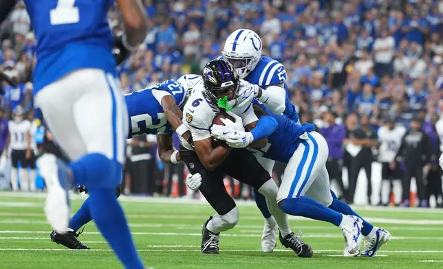 Baltimore Ravens' Ja'kobi Lane is stopped on a fourth down play during the first half of an NFL football game against the Indianapolis Colts Sunday, Sept. 13, 2026, in Indianapolis. (AP Photo/AJ Mast)