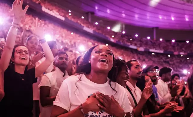 Faithful cheer Pope Leo XIV at the Stade de France in Saint-Denis near Paris during a prayer vigil with young people, Friday, Sept. 25, 2026. (AP Photo/Thomas Padilla)