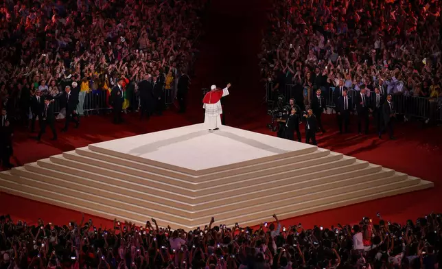 Pope Leo XIV waves after a prayer vigil with young people at the Stade de France in Saint-Denis near Paris, Friday, Sept. 25, 2026. (AP Photo/Thomas Padilla)