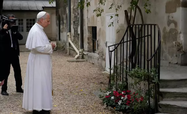 Pope Leo XIV arrives at the Institut Catholique de Paris to meet with members of the provincial synodal assembly, catechumens and neophytes, Saturday, Sept. 26, 2026, in Paris. (AP Photo/Gregorio Borgia)