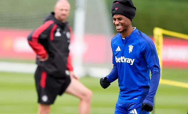 Manchester United's Marcus Rashford, foreground, gestures, during a training session at Carrington Training Centre in Manchester, England, Wednesday, Sept. 9, 2026. (Peter Byrne/PA via AP)