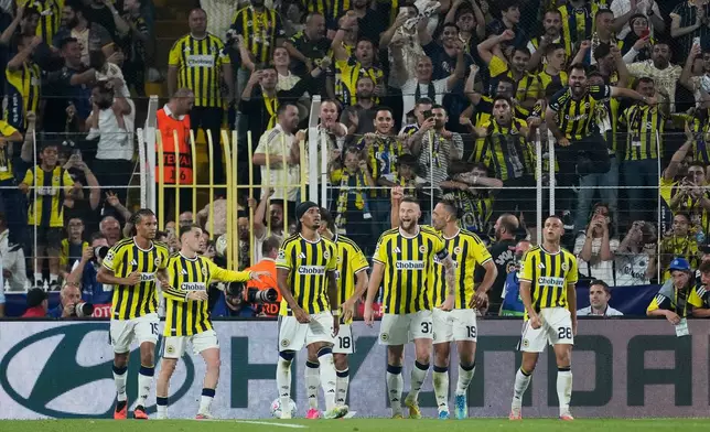 Fenerbahce's Archie Brown, centre, celebrates after scoring his side's first goal during the Champions League opening phase soccer match between Fenerbahce and Roma in Istanbul, Turkey, Thursday, Sept. 10, 2026. (AP Photo/Khalil Hamra)