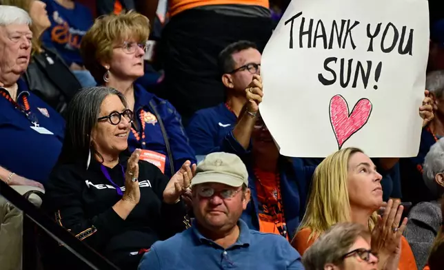 Beth Regan, left center, chairwoman of the Mohegan Tribe's Council of Elders, watches the last WNBA home game of the Connecticut Sun, against the Toronto Tempo, Thursday, Sept. 24, 2026, at Mohegan Sun in Uncasville, Conn. (AP Photo/Jessica Hill)