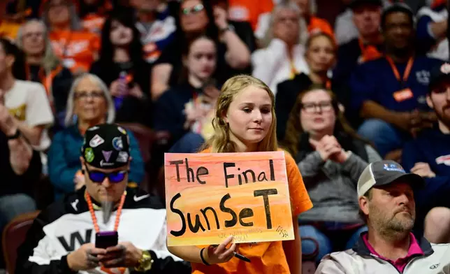 A fan holds up a sign in the first half of a WNBA basketball game between the Connecticut Sun and the Toronto Tempo, Thursday, Sept. 24, 2026, in Uncasville, Conn. (AP Photo/Jessica Hill)