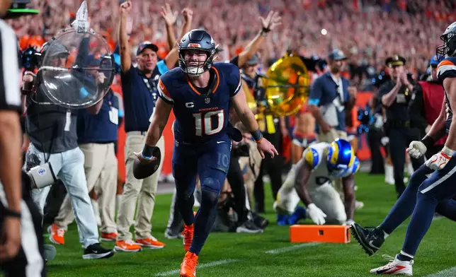 Denver Broncos quarterback Bo Nix reacts after a play against the Los Angeles Rams during the second half of an NFL football game Sunday, Sept. 27, 2026, in Denver. (AP Photo/Jack Dempsey)