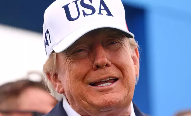 U.S. President Donald Trump arrives at the first tee during the Irish Open at the Trump International Golf Links course in Doonbeg, Ireland, Sunday, Sept. 13, 2026.(AP Photo/Peter Morrison)