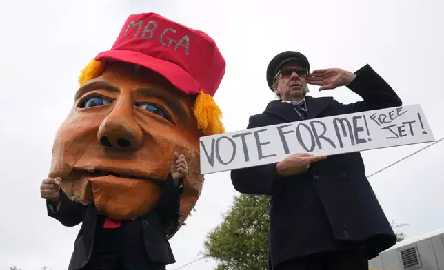 Protesters mocking U.S. President Donald Trump demonstrate near the Irish Open at the Trump International Golf Links course in Doonbeg, Ireland, Sunday, Sept. 13, 2026.(AP Photo/Kin Cheung)