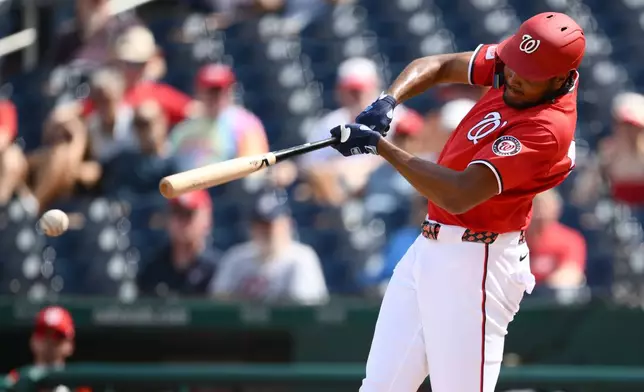 Washington Nationals' James Wood singles during the third inning of a baseball game against the Los Angeles Angels, Sunday, Sept. 13, 2026, in Washington. (AP Photo/Nick Wass)