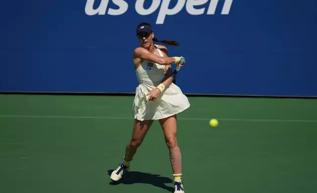 Sorana Cirstea, of Romania, returns the ball to Jasmine Paolini, of Italy, during the third round of the U.S. Open tennis championships Friday, Sept. 4, 2026, in New York. (AP Photo/Kirsty Wigglesworth)