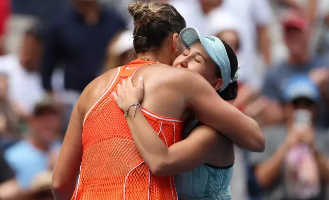 Aryna Sabalenka, of Belarus, left, embraces Kamilla Rakhimova, of Uzbekistan, after Sabalenka won their match during the third round of the U.S. Open tennis championships Friday, Sept. 4, 2026, in New York. (AP Photo/Heather Khalifa)