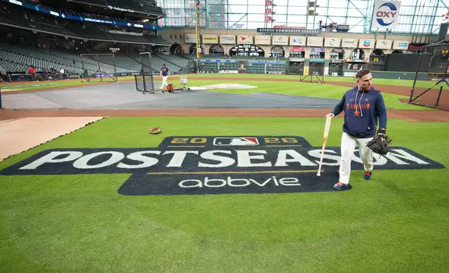 Houston Astros catcher Christian Vazquez walks across the field before Game 1 of baseball's American League Wild Card Series against the Chicago White Sox, Tuesday, Sept. 29, 2026, in Houston. (AP Photo/Karen Warren