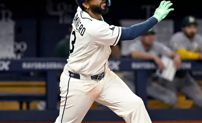 Tampa Bay Rays' Junior Caminero hits a walk-off home run during the ninth inning of a baseball game against the Athletics Tuesday, Sept. 15, 2026, in St. Petersburg, Fla. (AP Photo/Jason Behnken)