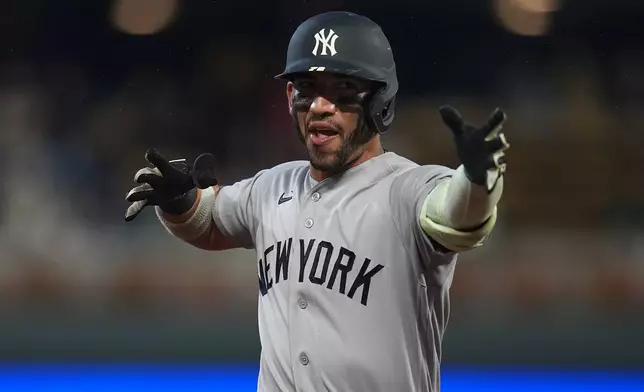 New York Yankees' Jose Caballero celebrates while running the bases after hitting a solo home run during the third inning of a baseball game against the Minnesota Twins, Monday, Sept. 14, 2026, in Minneapolis. (AP Photo/Abbie Parr)