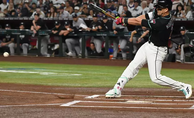 Arizona Diamondbacks' Lars Nootbaar hits during the first inning of a baseball game against the New York Yankees, Saturday, Sept. 19, 2026, in Phoenix. (AP Photo/Caitlin O'Hara)