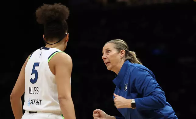 Minnesota Lynx head coach Cheryl Reeve speaks with guard Olivia Miles (5) during the first half of Game 2 of a WNBA basketball first-round playoff series against the New York Liberty, Tuesday, Sept. 29, 2026, in New York. (AP Photo/Heather Khalifa)