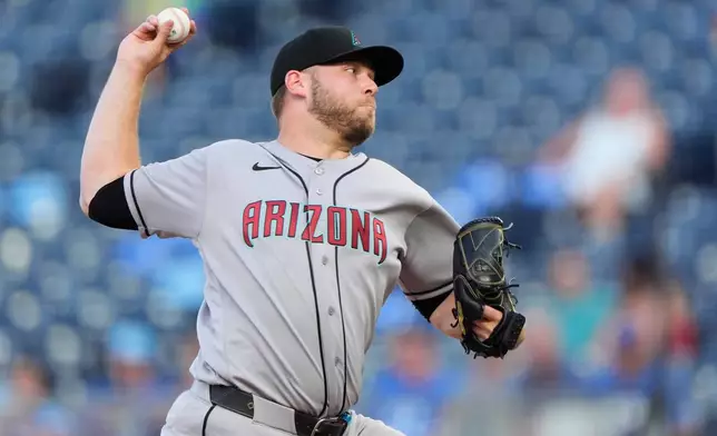 Arizona Diamondbacks starting pitcher Corbin Burnes throws during the first inning of a baseball game against the Kansas City Royals, Tuesday, Sept. 8, 2026, in Kansas City, Mo. (AP Photo/Charlie Riedel)