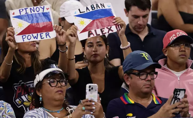 Fans of Alexandra Eala, of the Philippines, hold up signs during her match against Mary Stoiana, of the United States, in the first round of the U.S. Open tennis championships Tuesday, Sept. 1, 2026, in New York. (AP Photo/Adam Hunger)