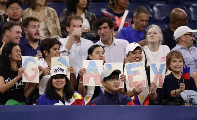 Fans of Alexandra Eala, of the Philippines, spell out "GO ALEX" with letters before her match against Mary Stoiana, of the United States, in the first round of the U.S. Open tennis championships Tuesday, Sept. 1, 2026, in New York. (AP Photo/Adam Hunger)