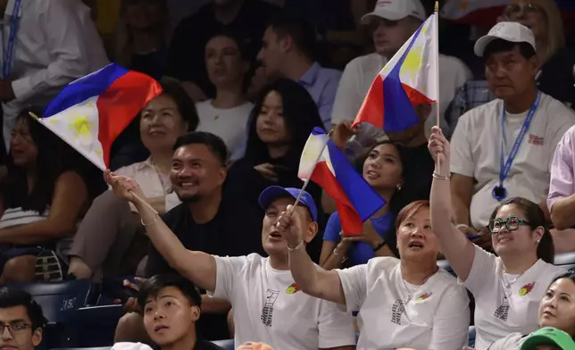 Fans of Alexandra Eala, of the Philippines, cheer during her match against Mary Stoiana, of the United States, in the first round of the U.S. Open tennis championships Tuesday, Sept. 1, 2026, in New York. (AP Photo/Adam Hunger)