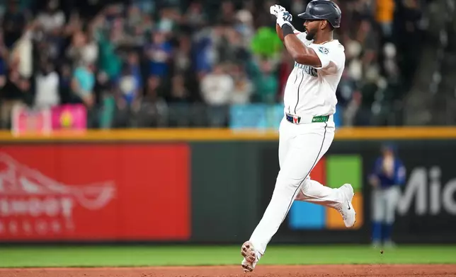 Seattle Mariners designated hitter Lazaro Montes jogs the bases after hitting a three-run home run against the Texas Rangers during the fourth inning of a baseball game, Tuesday, Sept. 8, 2026, in Seattle. (AP Photo/Lindsey Wasson)