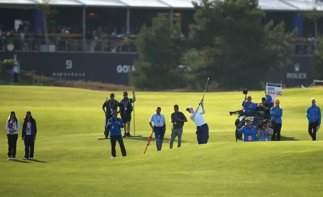 Nelly Korda of the United States plays from the 16th fairway during the Solheim Cup in Den Bosch, Netherlands, Friday, Sept. 11, 2026. (AP Photo/Alastair Grant)