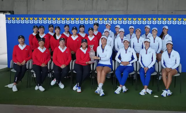 United States team, left ,and Europe team right pose for the media during a photocell for the Solheim Cup at the Bernardus Golf course in Vught, Netherlands, Tuesday, Sept. 8, 2026. (AP Photo/Alastair Grant)