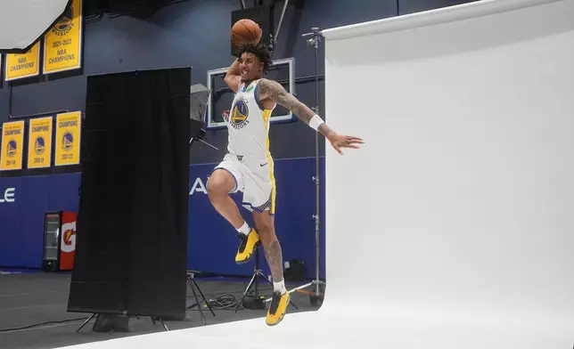 Golden State Warriors forward Yaxel Lendeborg (1) poses for photos during the NBA basketball team's media day, Monday, Sept. 28, 2026, in San Francisco. (AP Photo/Jeff Chiu)