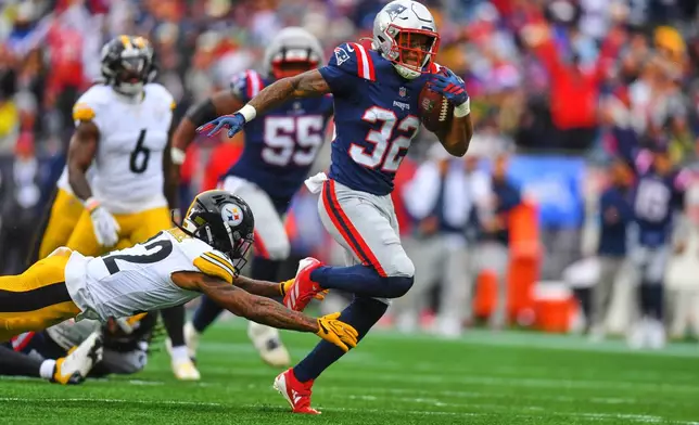 New England Patriots' Treveyon Henderson (32) runs past Pittsburgh Steelers' Asante Samuel Jr. (22) for a touchdown during the first half of an NFL football game, Sunday, Sept. 20, 2026, in Foxboro, Mass. (AP Photo/Steven Senne)
