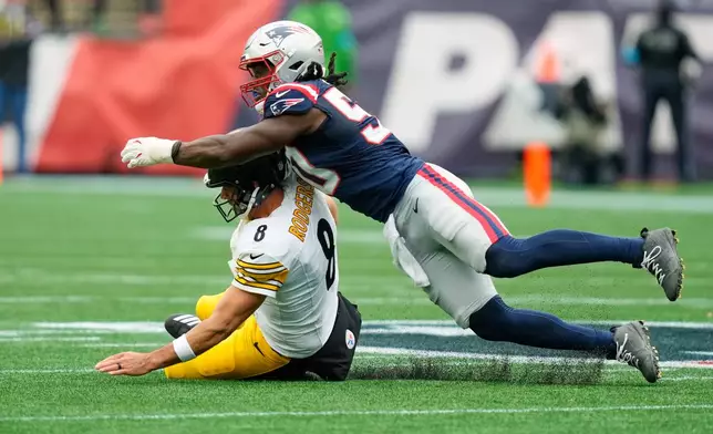 New England Patriots' Gabe Jacas, right, sacks Pittsburgh Steelers' Aaron Rodgers, left, during the first half of an NFL football game, Sunday, Sept. 20, 2026, in Foxboro, Mass. (AP Photo/Charles Krupa)