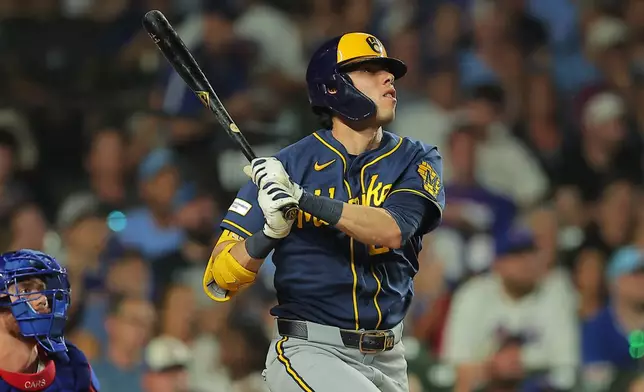 Milwaukee Brewers' Christian Yelich watches his two-run home run during the sixth inning of a baseball game against the Chicago Cubs, Tuesday, Sept. 1, 2026, in Chicago. (AP Photo/Melissa Tamez)