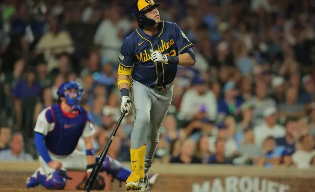 Milwaukee Brewers' Christian Yelich watches his two-run home run during the sixth inning of a baseball game against the Chicago Cubs, Tuesday, Sept. 1, 2026, in Chicago. (AP Photo/Melissa Tamez)