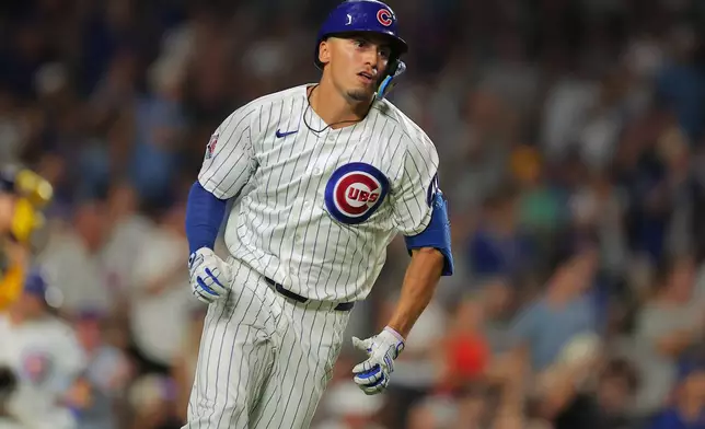 Chicago Cubs' Tyrone Taylor watches his two-run RBI double hit during the fourth inning of a baseball game against the Milwaukee Brewers, Tuesday, Sept. 1, 2026, in Chicago. (AP Photo/Melissa Tamez)