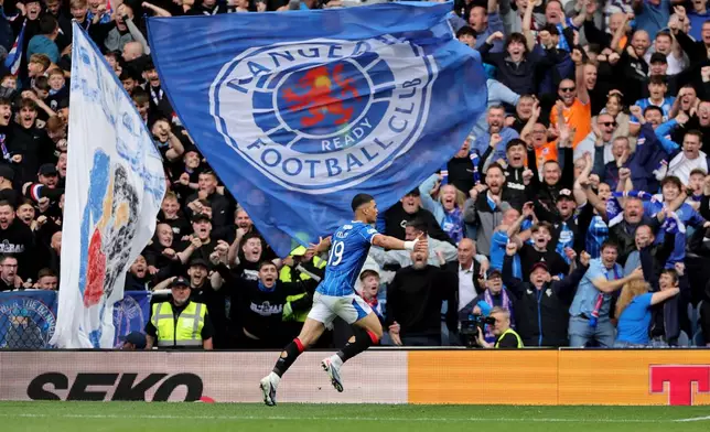 Rangers' Kevin Kelsy celebrates scoring their side's second goal during the Scottish League Cup soccer match between Rangers and Celtic, in Glasgow, Sunday Sept. 13, 2026. (Steve Welsh/PA via AP)